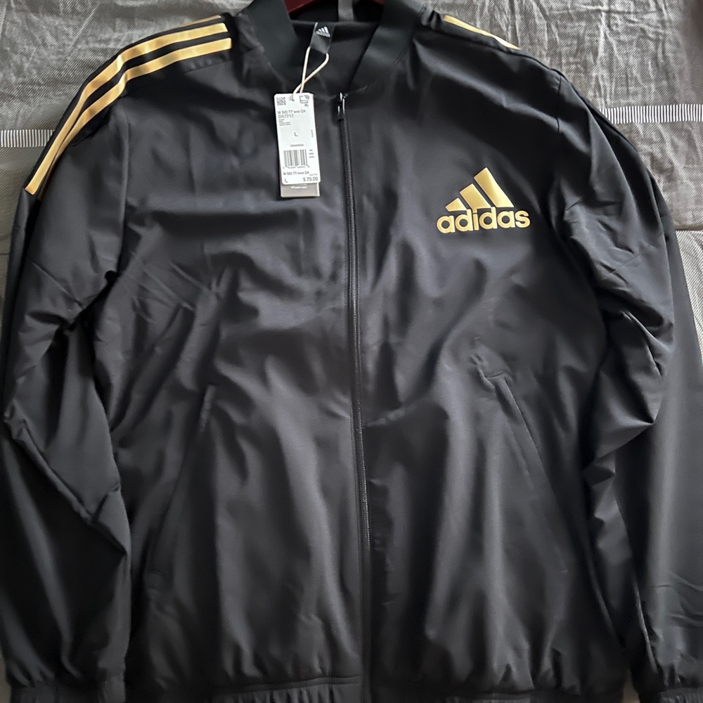 Adidas woven track suit.